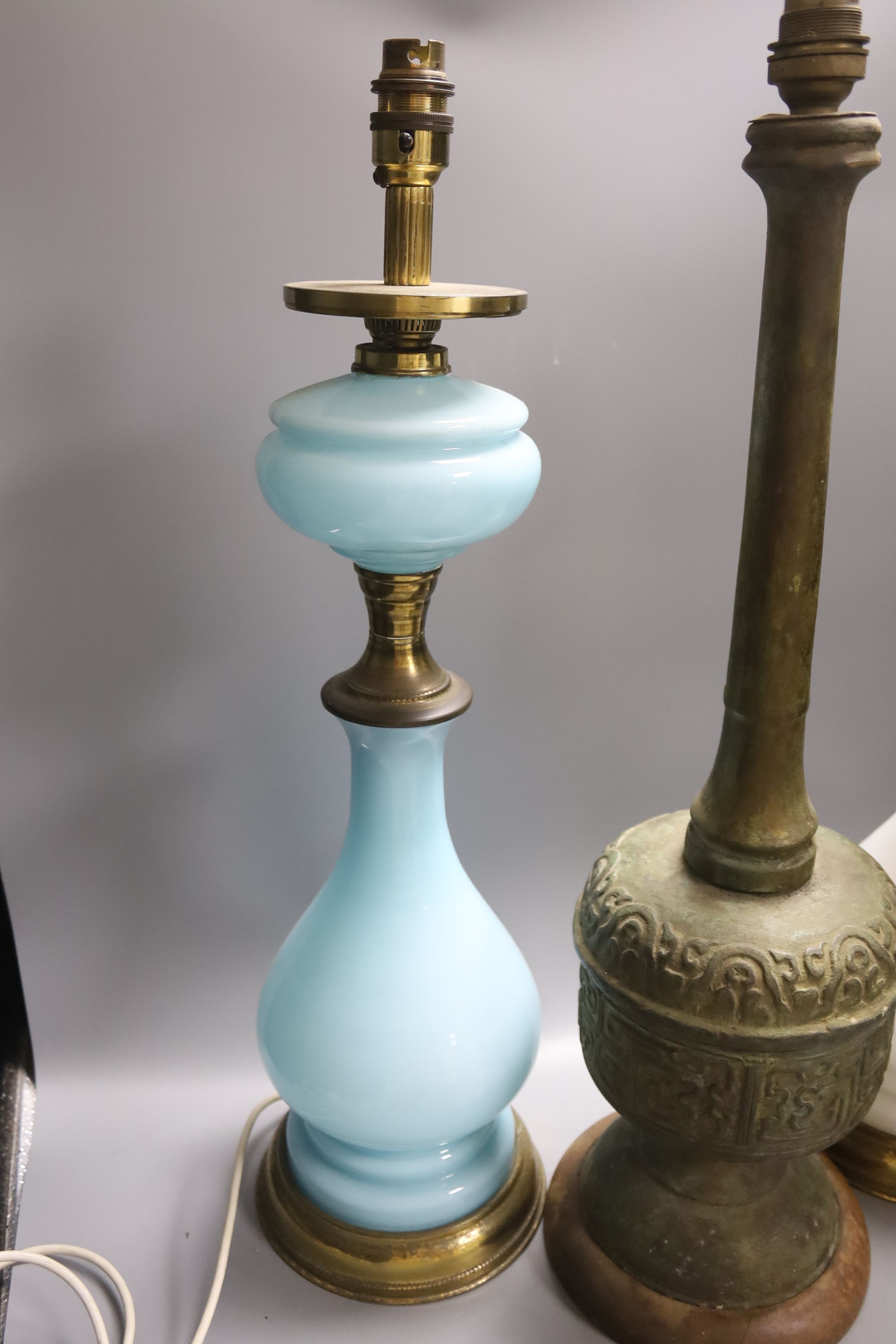 A pair of Victorian Opaline glass table lamps, 55cm high and archaistic brass table lamp